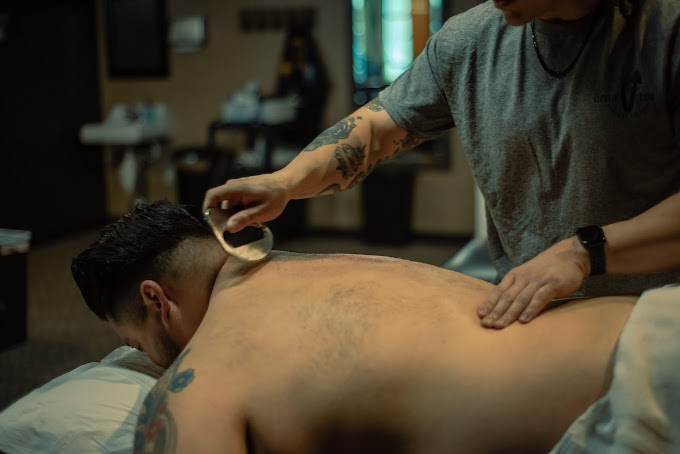 Dr. Richi Krottmayer from Elevate You  Physical Therapy  using scraping technique.